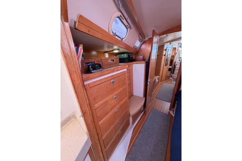Seaduction Yacht Photos Pics Interior of 2005 Catalina 42 MkII sailboat with wooden cabinetry and cozy design.