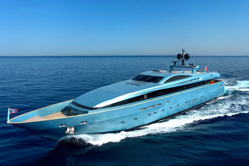 Queen Blue Yacht Photos Pics Luxury 2007 Baglietto 44 Fast yacht cruising on open sea under clear blue sky.