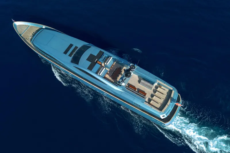 Queen Blue Yacht Photos Pics Aerial view of 2007 Baglietto 44 Fast yacht cruising on deep blue ocean waters.