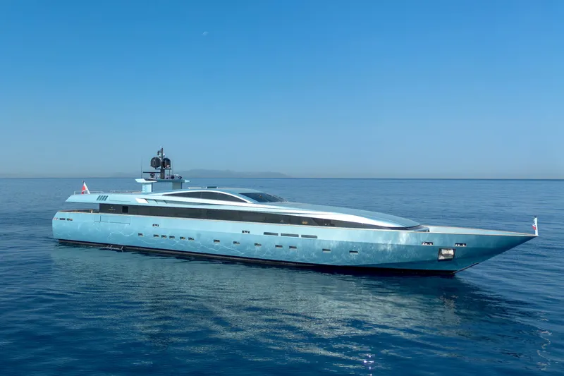 Queen Blue Yacht Photos Pics Luxurious 2007 Baglietto 44 Fast yacht cruising on calm blue waters.