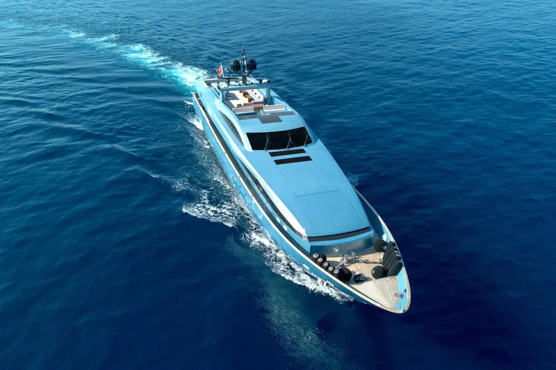 Queen Blue Yacht Photos Pics Aerial view of 2007 Baglietto 44 Fast yacht cruising on open blue sea.