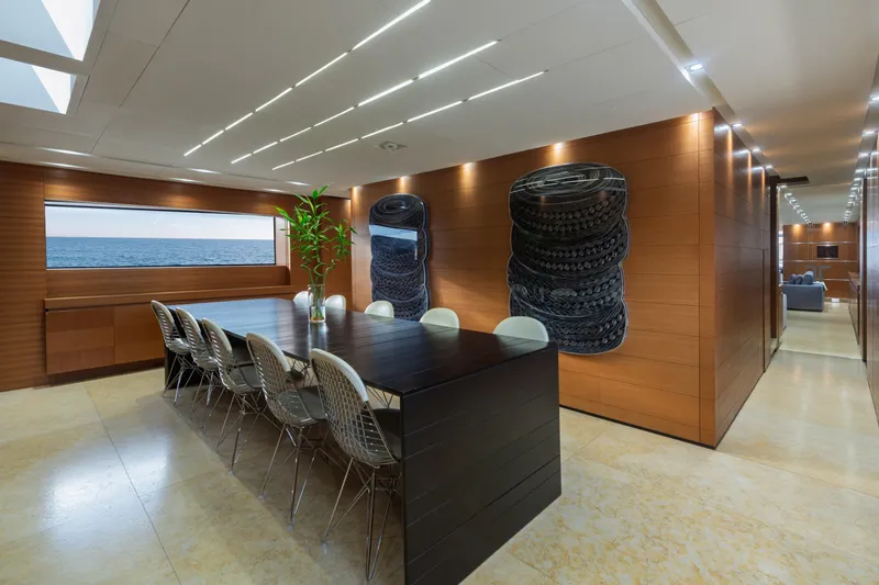 Queen Blue Yacht Photos Pics Luxurious interior of 2007 Baglietto 44 Fast yacht with elegant dining area and ocean view.