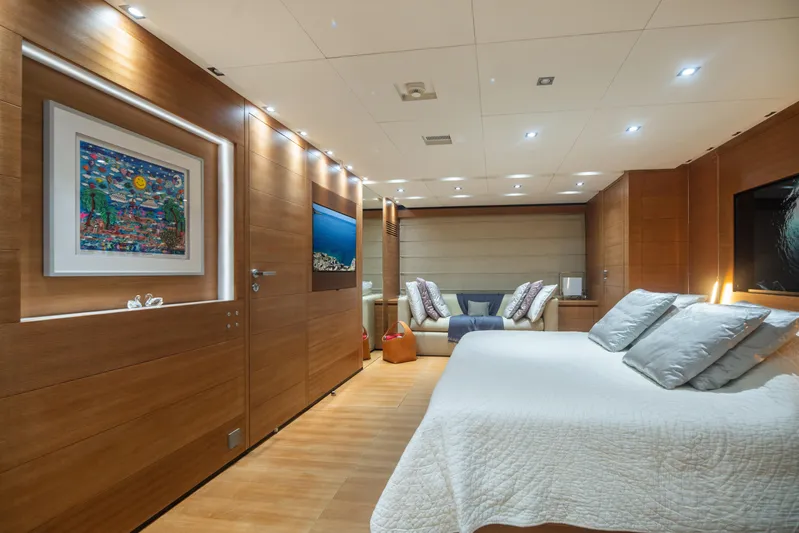 Queen Blue Yacht Photos Pics Luxurious interior of 2007 Baglietto 44 Fast yacht with modern wood paneling and elegant decor.