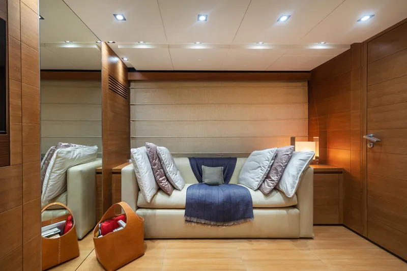 Queen Blue Yacht Photos Pics Luxurious interior of 2007 Baglietto 44 Fast yacht with cozy seating and elegant decor.