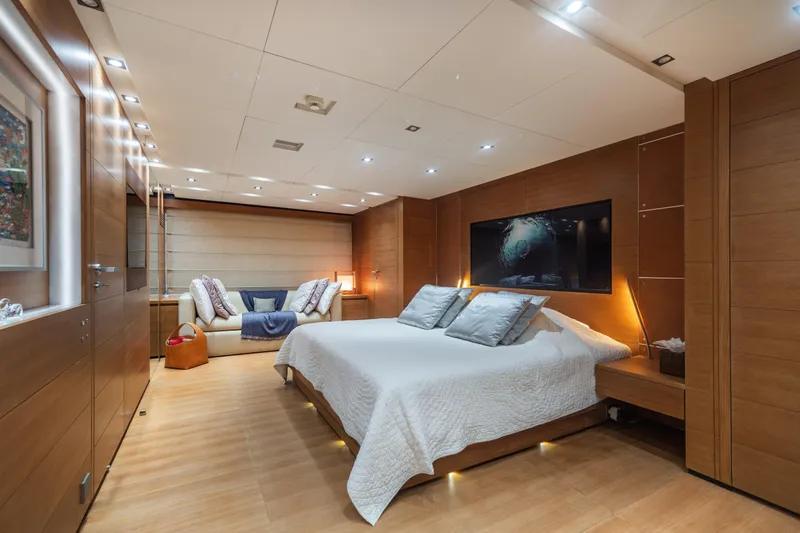 Queen Blue Yacht Photos Pics Luxurious bedroom interior on 2007 Baglietto 44 Fast yacht, featuring modern design and cozy ambiance.