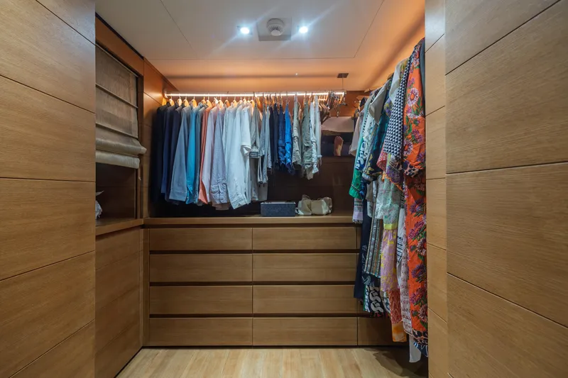 Queen Blue Yacht Photos Pics Luxurious wooden closet with hanging clothes on Baglietto 44 Fast yacht, 2007 model.