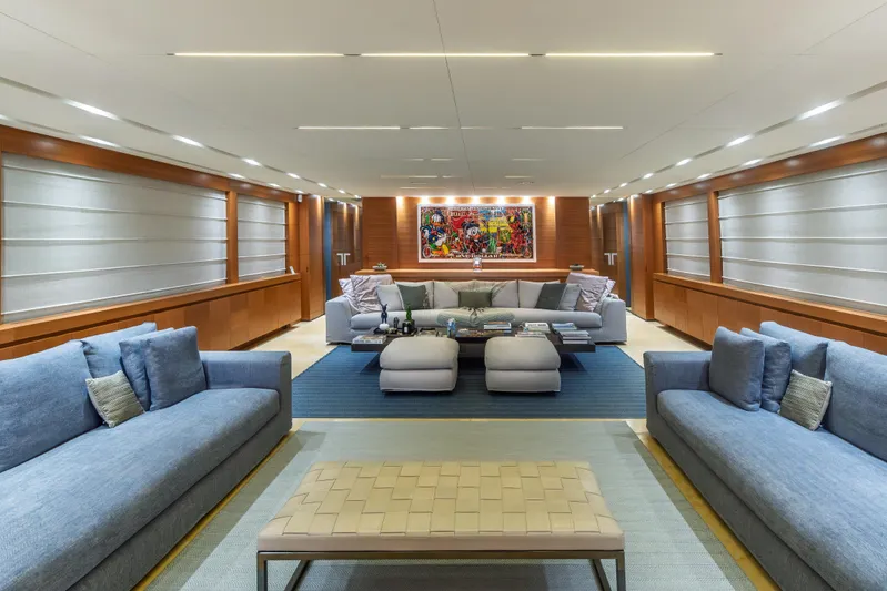 Queen Blue Yacht Photos Pics Luxurious interior of 2007 Baglietto 44 Fast yacht with modern sofas and vibrant artwork.