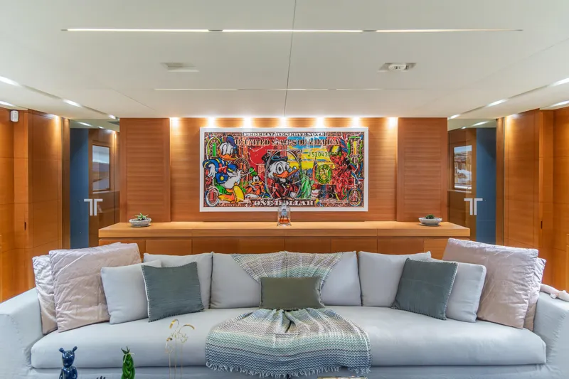 Queen Blue Yacht Photos Pics Luxurious interior of 2007 Baglietto 44 Fast yacht with modern art and plush seating.