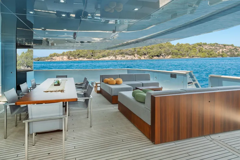 Queen Blue Yacht Photos Pics Luxurious deck of 2007 Baglietto 44 Fast yacht with elegant seating and dining area.