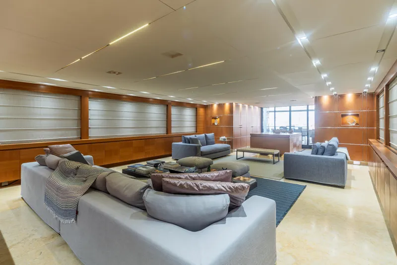 Queen Blue Yacht Photos Pics Luxurious interior of 2007 Baglietto 44 Fast yacht with modern seating and elegant wood paneling.