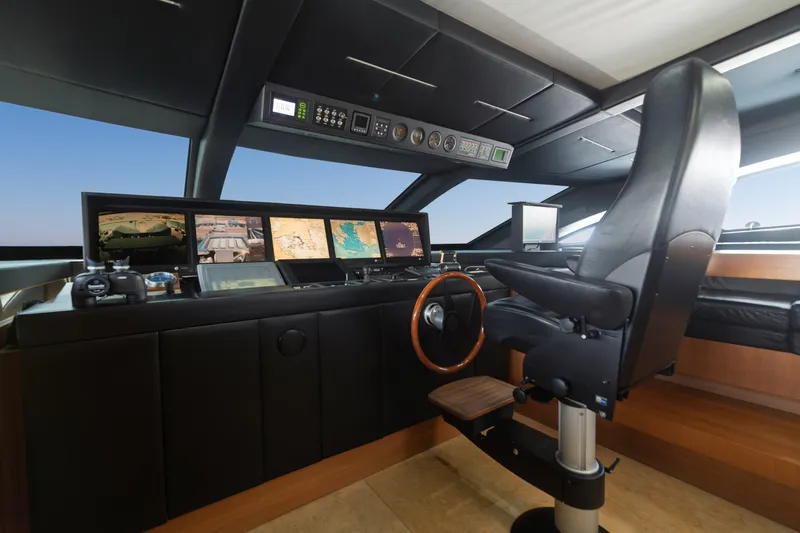 Queen Blue Yacht Photos Pics Luxurious 2007 Baglietto 44 Fast yacht cockpit with advanced navigation systems and captain's chair.