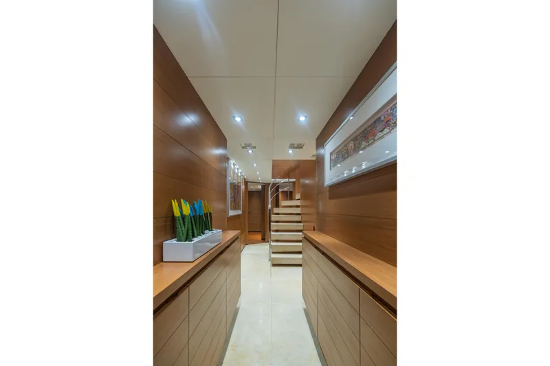 Queen Blue Yacht Photos Pics Luxurious interior hallway of 2007 Baglietto 44 Fast yacht with modern decor and artwork.