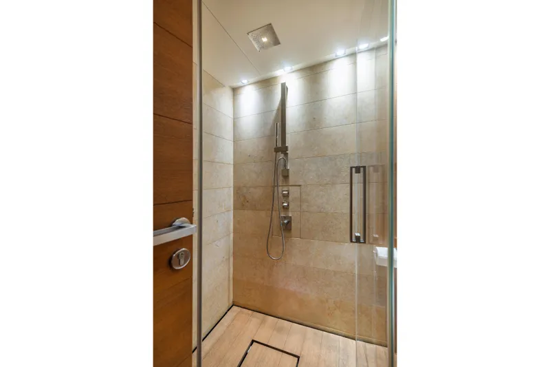 Queen Blue Yacht Photos Pics Luxurious shower in 2007 Baglietto 44 Fast yacht with modern fixtures and elegant design.