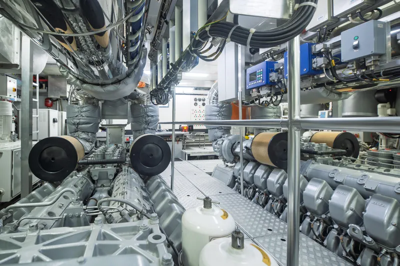 Queen Blue Yacht Photos Pics Engine room of 2007 Baglietto 44 Fast yacht, showcasing advanced machinery and equipment.