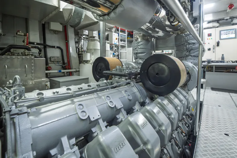 Queen Blue Yacht Photos Pics Engine room of 2007 Baglietto 44 Fast yacht, showcasing advanced machinery and equipment.