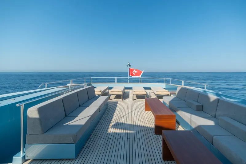 Queen Blue Yacht Photos Pics Luxurious deck of 2007 Baglietto 44 Fast yacht with ocean view and seating area.