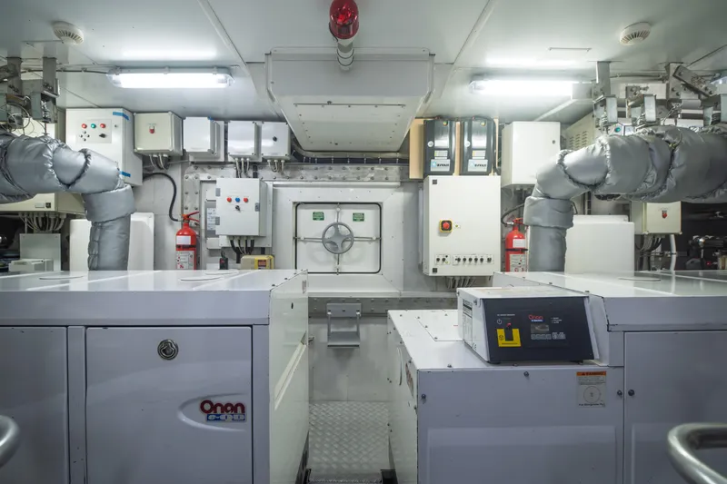 Queen Blue Yacht Photos Pics Engine room of 2007 Baglietto 44 Fast yacht, featuring Onan generator and control panels.
