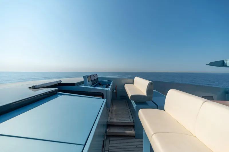 Queen Blue Yacht Photos Pics Luxurious 2007 Baglietto 44 Fast yacht deck with ocean view and seating.