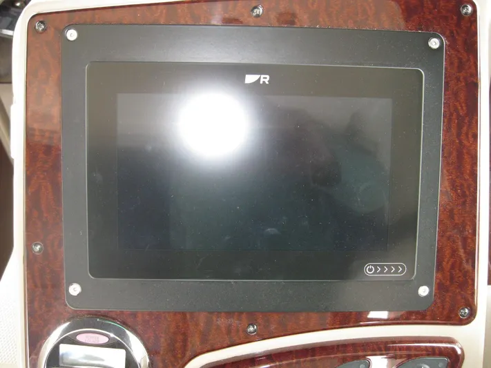  Yacht Photos Pics Dashboard display of 2008 Sea Ray 330 Sundancer boat with wood paneling.