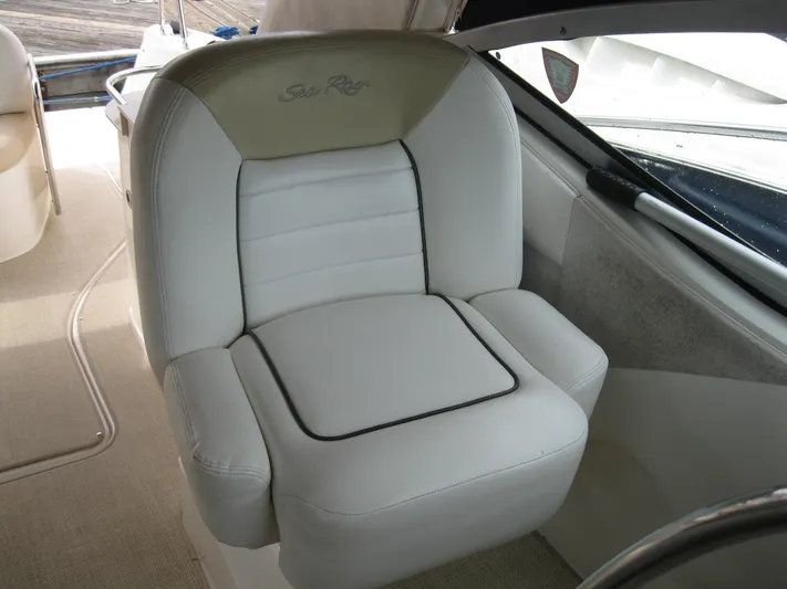  Yacht Photos Pics Captain's chair on 2008 Sea Ray 330 Sundancer, featuring white leather upholstery.