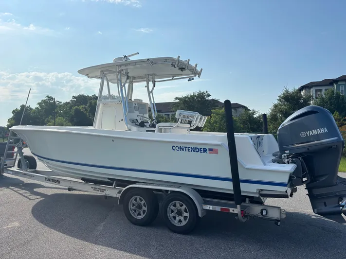  Yacht Photos Pics 2012 Contender 28 Sport boat on trailer with Yamaha outboard motor.