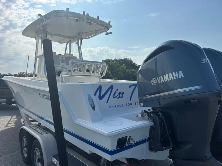  Yacht Photos Pics 2012 Contender 28 Sport boat with Yamaha engines, parked on a trailer.