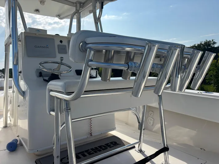  Yacht Photos Pics 2012 Contender 28 Sport boat cockpit with Garmin equipment and rod holders.