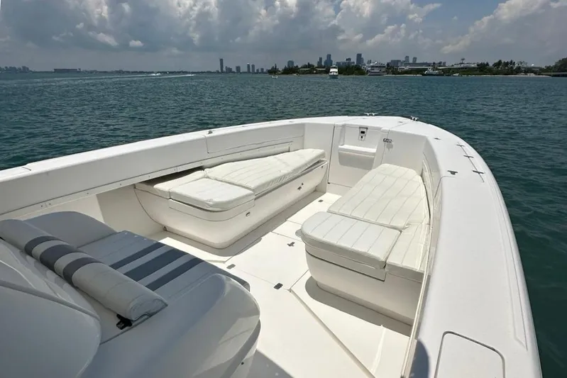  Yacht Photos Pics 2006 Intrepid 350 Open CC boat with spacious seating on calm waters.