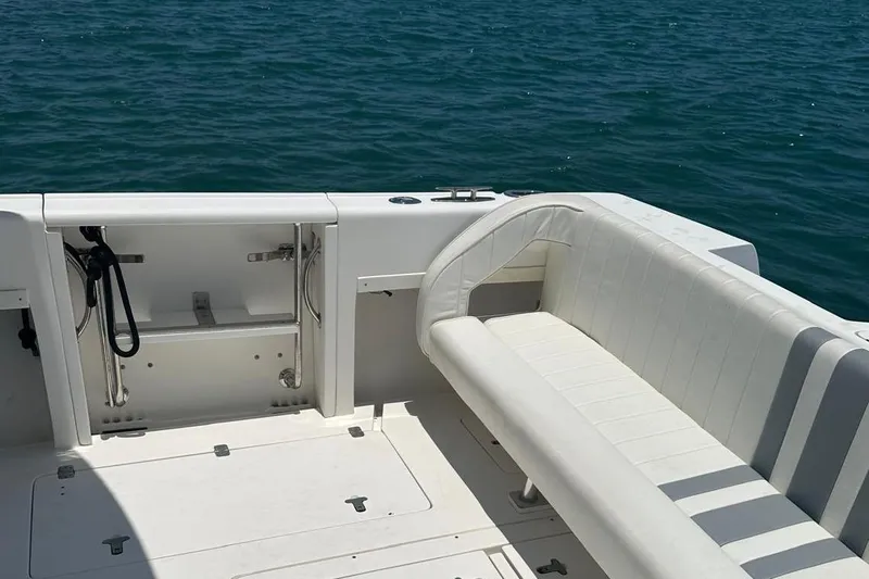  Yacht Photos Pics 2006 Intrepid 350 Open CC boat interior with white seating, ocean backdrop.