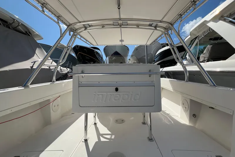  Yacht Photos Pics 2006 Intrepid 350 Open CC boat interior with helm station and canopy.