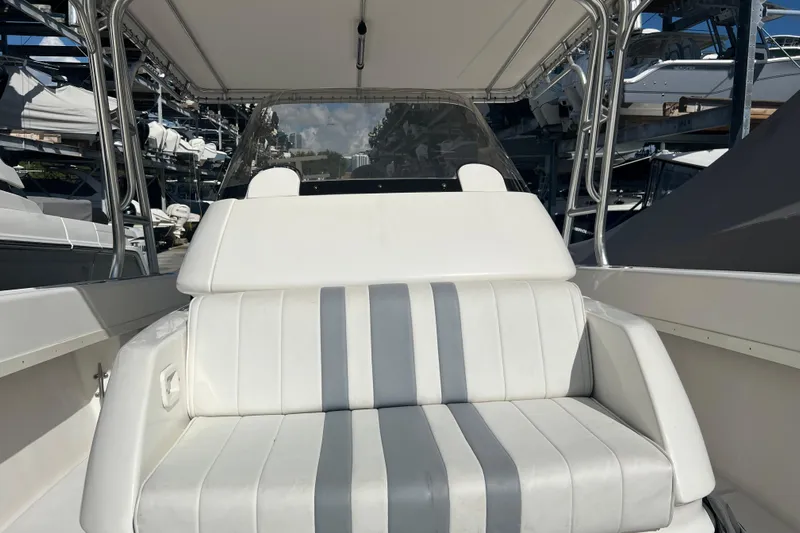  Yacht Photos Pics 2006 Intrepid 350 Open CC boat interior with white seating and canopy.