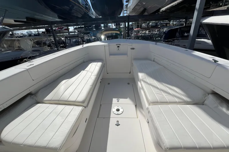  Yacht Photos Pics 2006 Intrepid 350 Open CC boat interior with white cushioned seating.