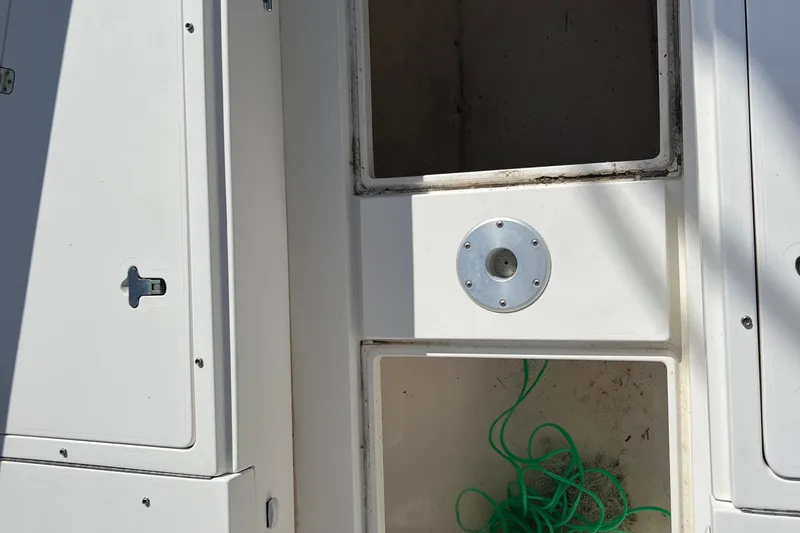  Yacht Photos Pics 2006 Intrepid 350 Open CC boat storage compartments with green rope inside.