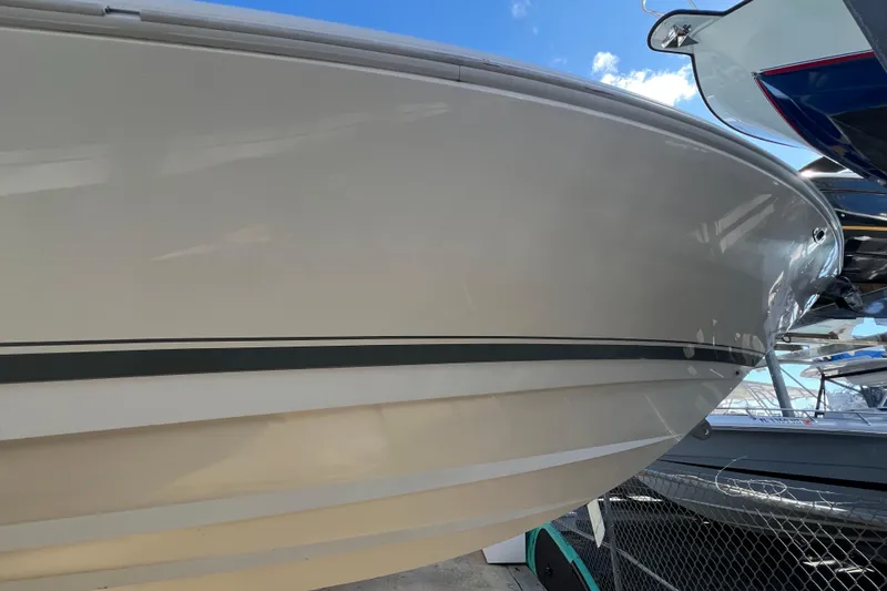  Yacht Photos Pics 2006 Intrepid 350 Open CC boat hull, docked with clear blue sky background.