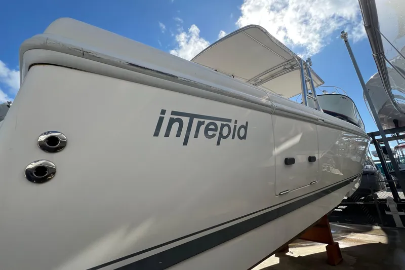  Yacht Photos Pics 2006 Intrepid 350 Open CC boat with clear blue sky background.