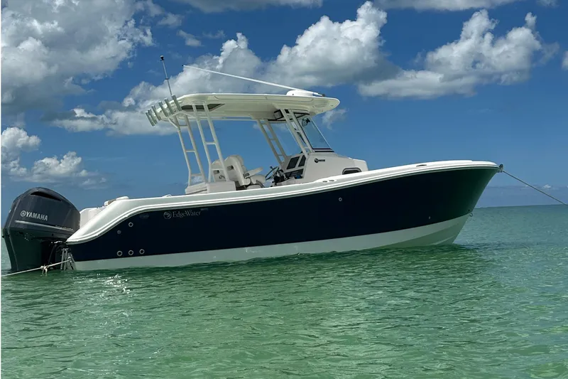  Yacht Photos Pics 2016 Edgewater 280CC boat on clear water under a partly cloudy sky.
