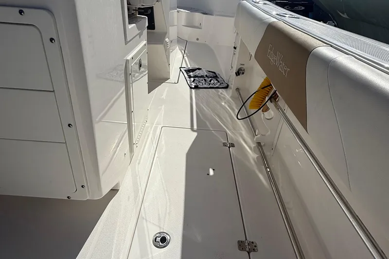  Yacht Photos Pics 2016 Edgewater 280CC boat interior with white deck and seating.