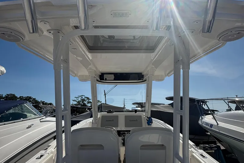 Yacht Photos Pics 2016 Edgewater 280CC boat interior with sunlight streaming through the canopy.