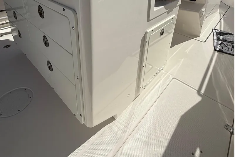  Yacht Photos Pics 2016 Edgewater 280CC boat interior with storage compartments and non-slip flooring.