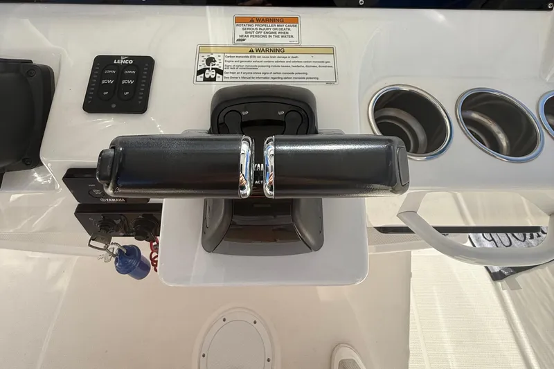  Yacht Photos Pics Control panel of a 2016 Edgewater 280CC boat with throttle and cup holders.