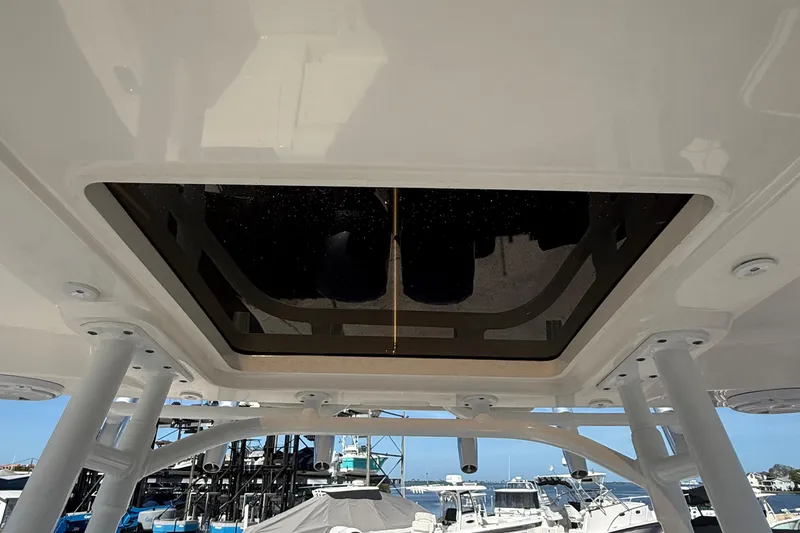  Yacht Photos Pics 2016 Edgewater 280CC boat roof hatch with marina view in background.
