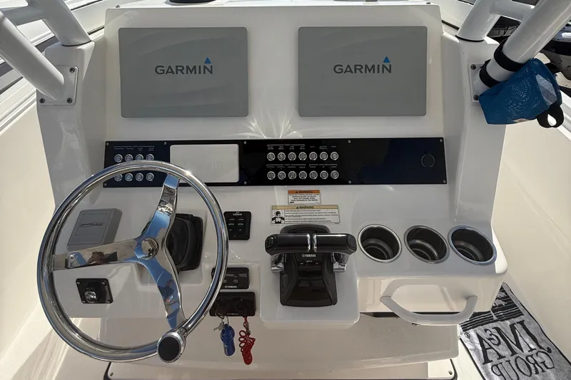  Yacht Photos Pics Edgewater 280CC 2016 boat dashboard with Garmin displays and steering wheel.