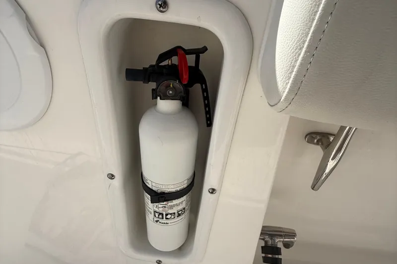  Yacht Photos Pics Fire extinguisher mounted on 2016 Edgewater 280CC boat, safety equipment detail.