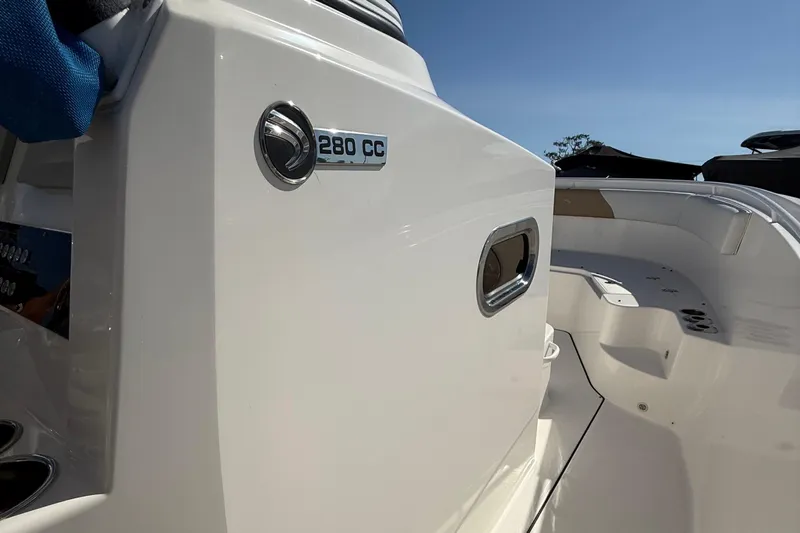  Yacht Photos Pics Edgewater 280CC 2016 boat interior with sleek white design and logo detail.