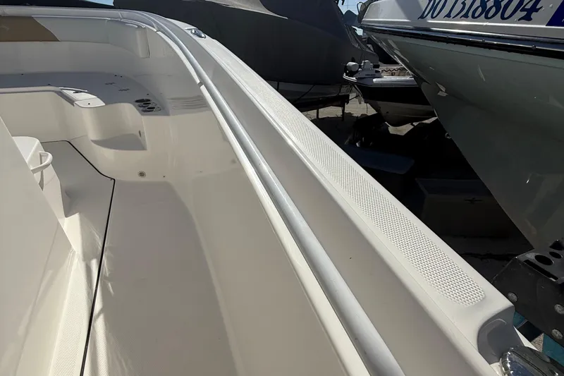  Yacht Photos Pics 2016 Edgewater 280CC boat interior, showcasing spacious seating and sleek design.