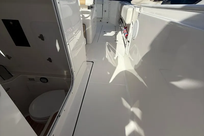  Yacht Photos Pics 2016 Edgewater 280CC boat interior with clean deck and visible toilet area.
