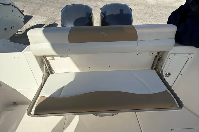  Yacht Photos Pics 2016 Edgewater 280CC boat with foldable rear seat and dual outboard motors.
