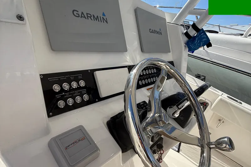  Yacht Photos Pics Edgewater 280CC 2016 boat dashboard with Garmin navigation and Optimus EPS system.