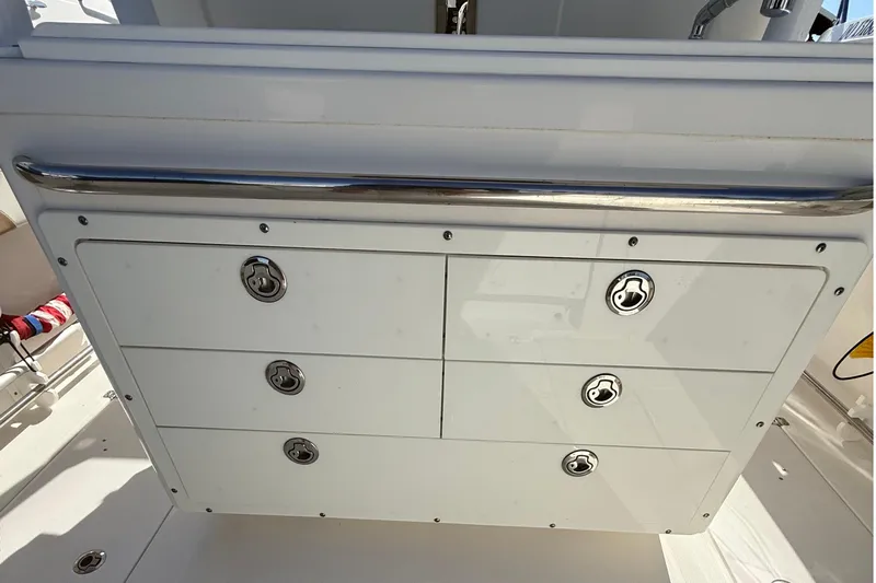  Yacht Photos Pics Storage compartment on a 2016 Edgewater 280CC boat with stainless steel handles.