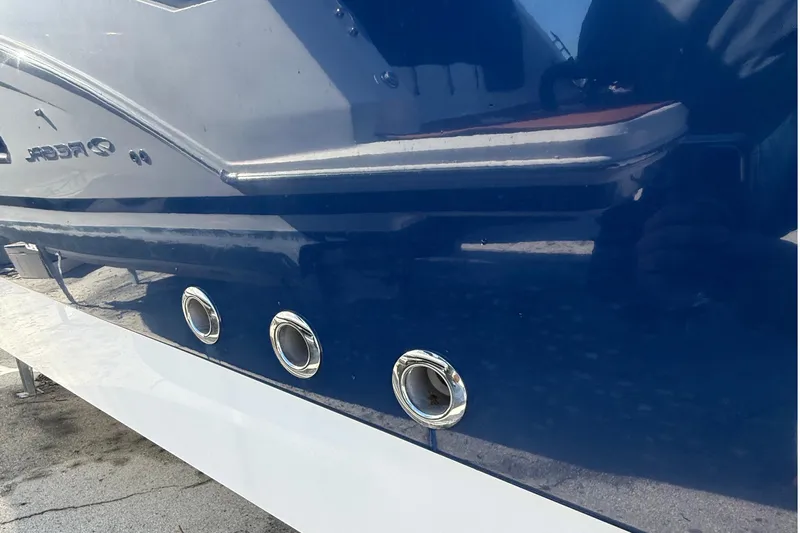  Yacht Photos Pics 2016 Edgewater 280CC boat hull with chrome fittings and sleek blue finish.